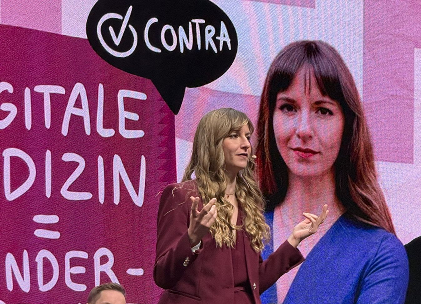 Beatrice Aretz on a DMEA event stage.